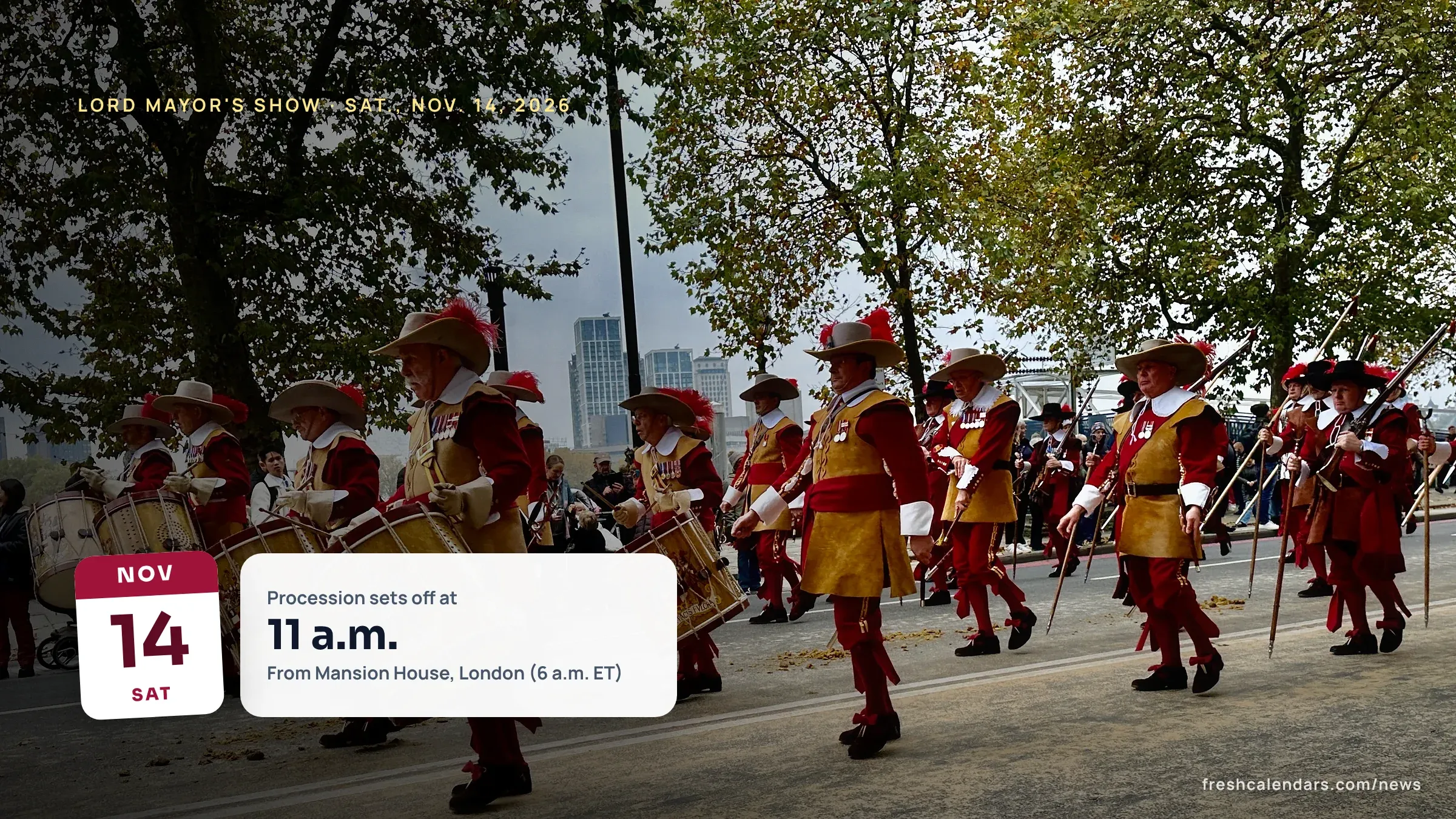 Drummers in red and gold uniforms march in a past Lord Mayor's Show procession in the City of London